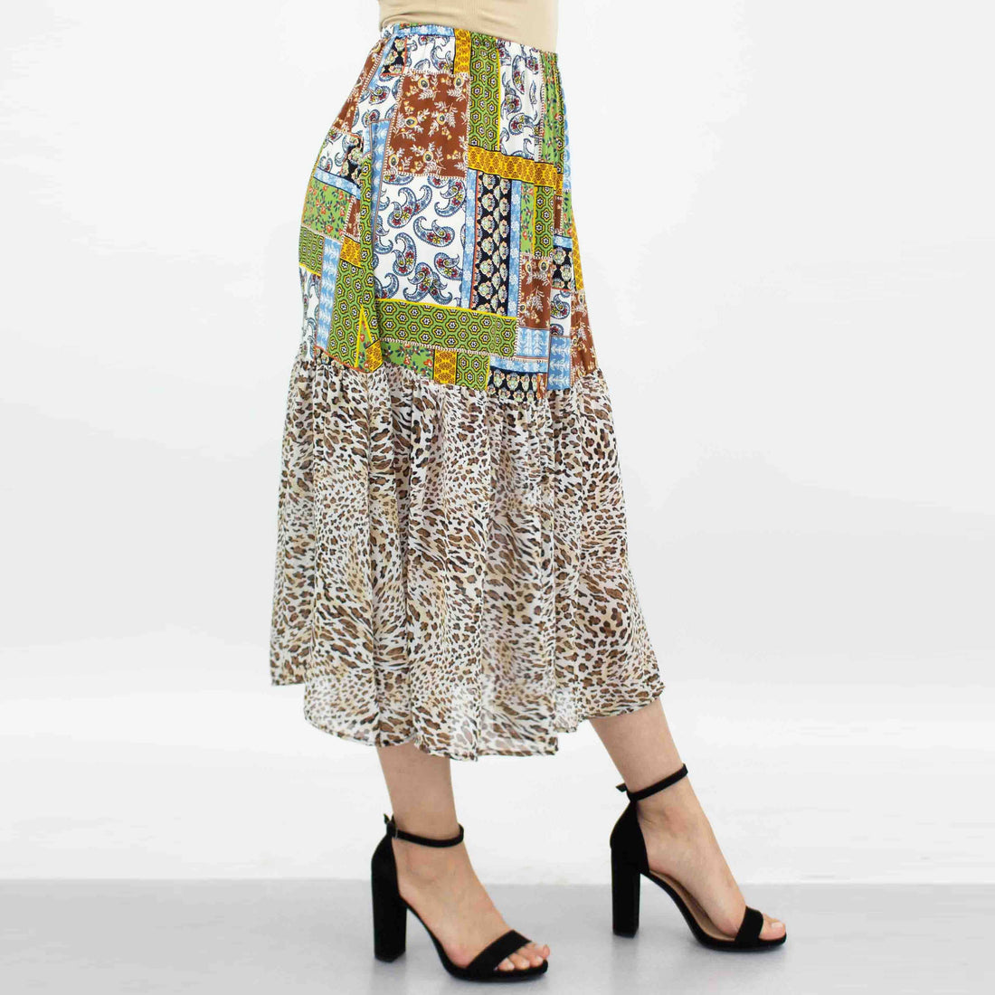 Animal print color block skirt in green by Yellow Hera, showing a stylish clothing piece with bold animal patterns and vibrant color blocking.