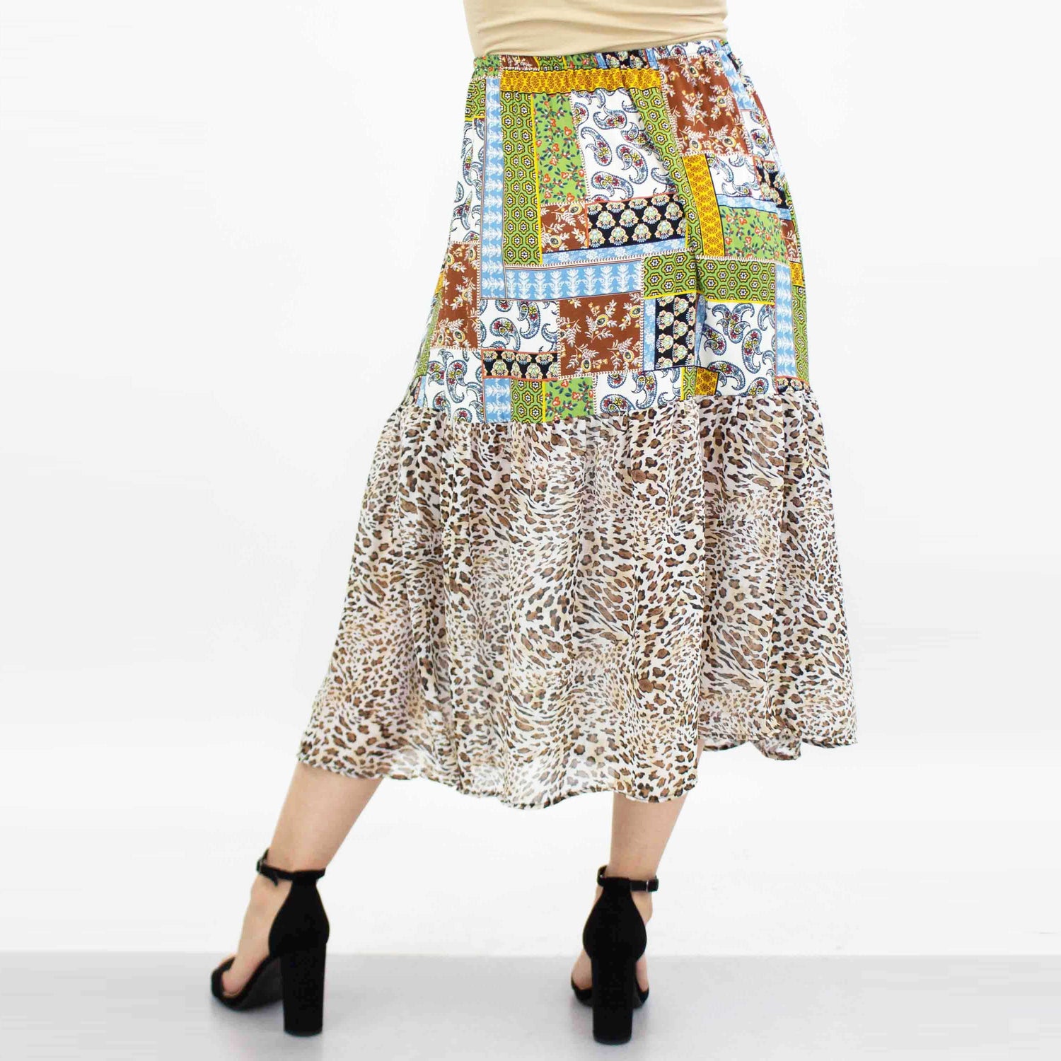 Green animal print color block skirt from Yellow Hera, featuring bold patterns and vibrant fabric for stylish casual wear.