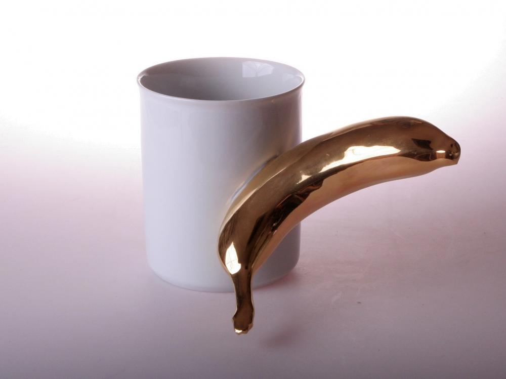 Black and white retro porcelain cup with "BANANA" design, by Pink Aether, perfect for unique gift-giving.
