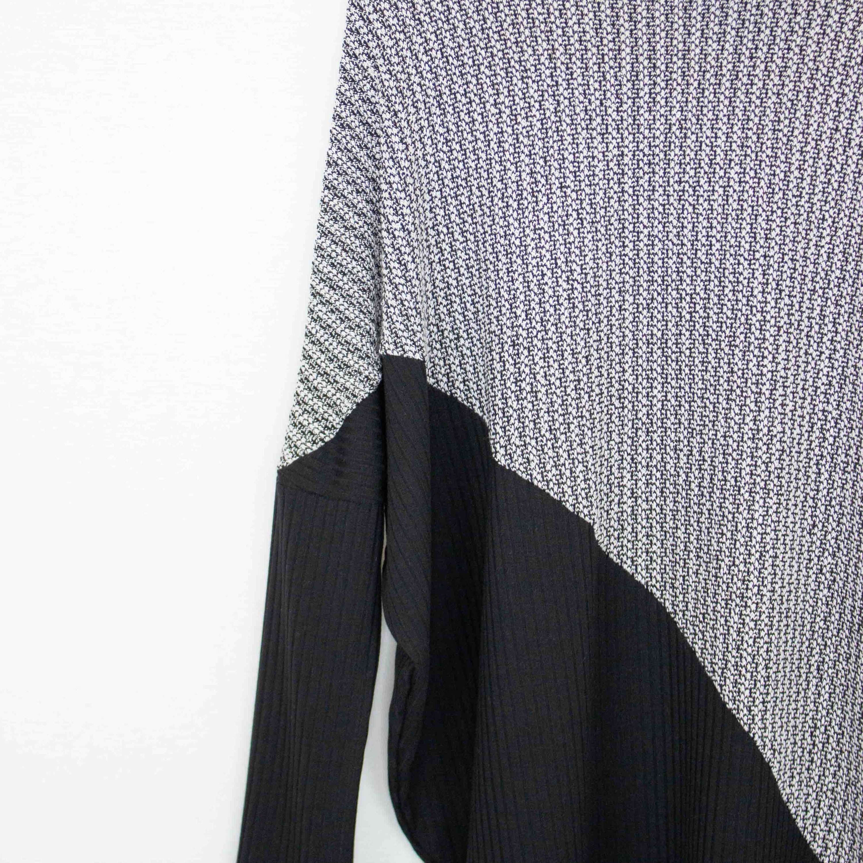 Yellow Hera turtle neck sweater with diagonal color block design, featuring a cozy knit and stylish fit.