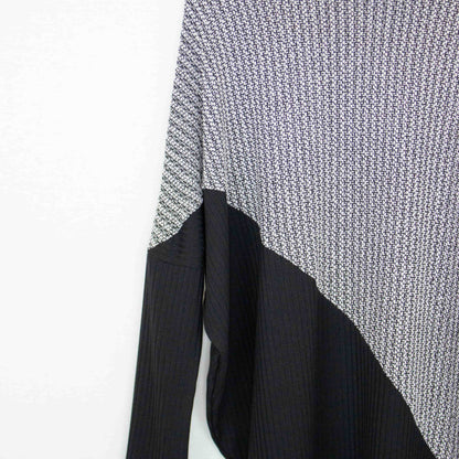 Yellow Hera turtle neck sweater with diagonal color block design, featuring a cozy knit and stylish fit.