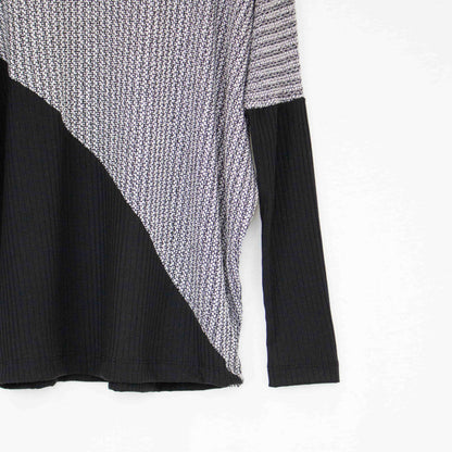 Yellow Hera turtle neck sweater featuring a diagonal color block design with long sleeves and a cozy fit.