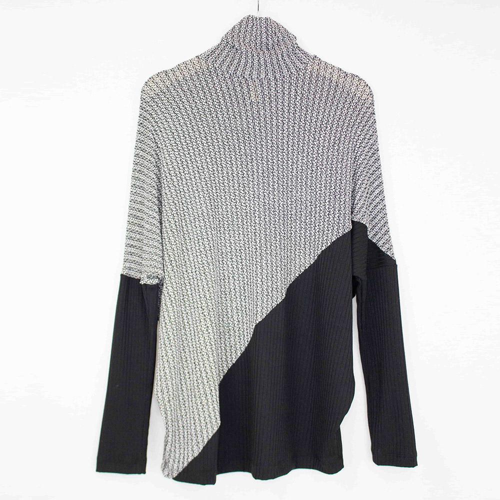 Yellow Hera turtle neck sweater with diagonal color block design, long sleeves, and cozy knit fabric.