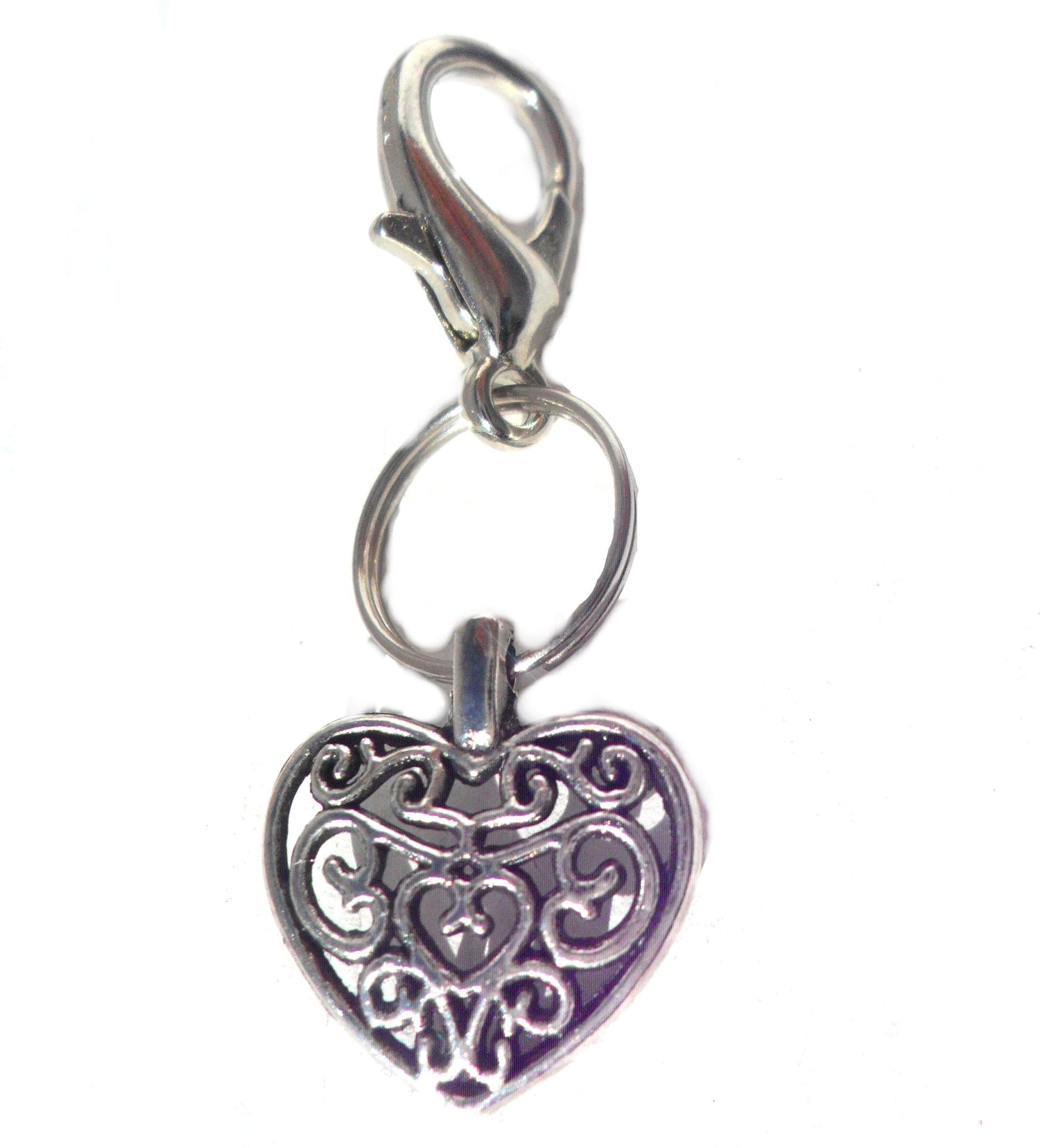 Salmon Oscar filigree heart pet charm attached to a collar, decorative pet jewelry for dogs or cats.