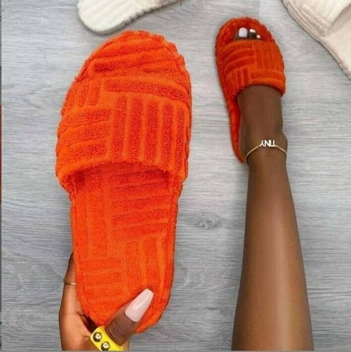 Red Iphigenia thick bottom embossed cotton fur women’s slippers with cozy, plush interior and textured embossed design.