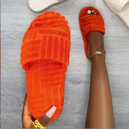 Red Iphigenia thick bottom embossed cotton fur women’s slippers with cozy, plush interior and textured embossed design.