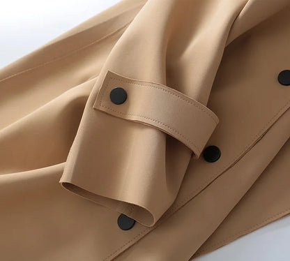 Yellow Angel French fashion light luxury windbreaker, mid-length autumn jacket with sleek design and tech accessory features.