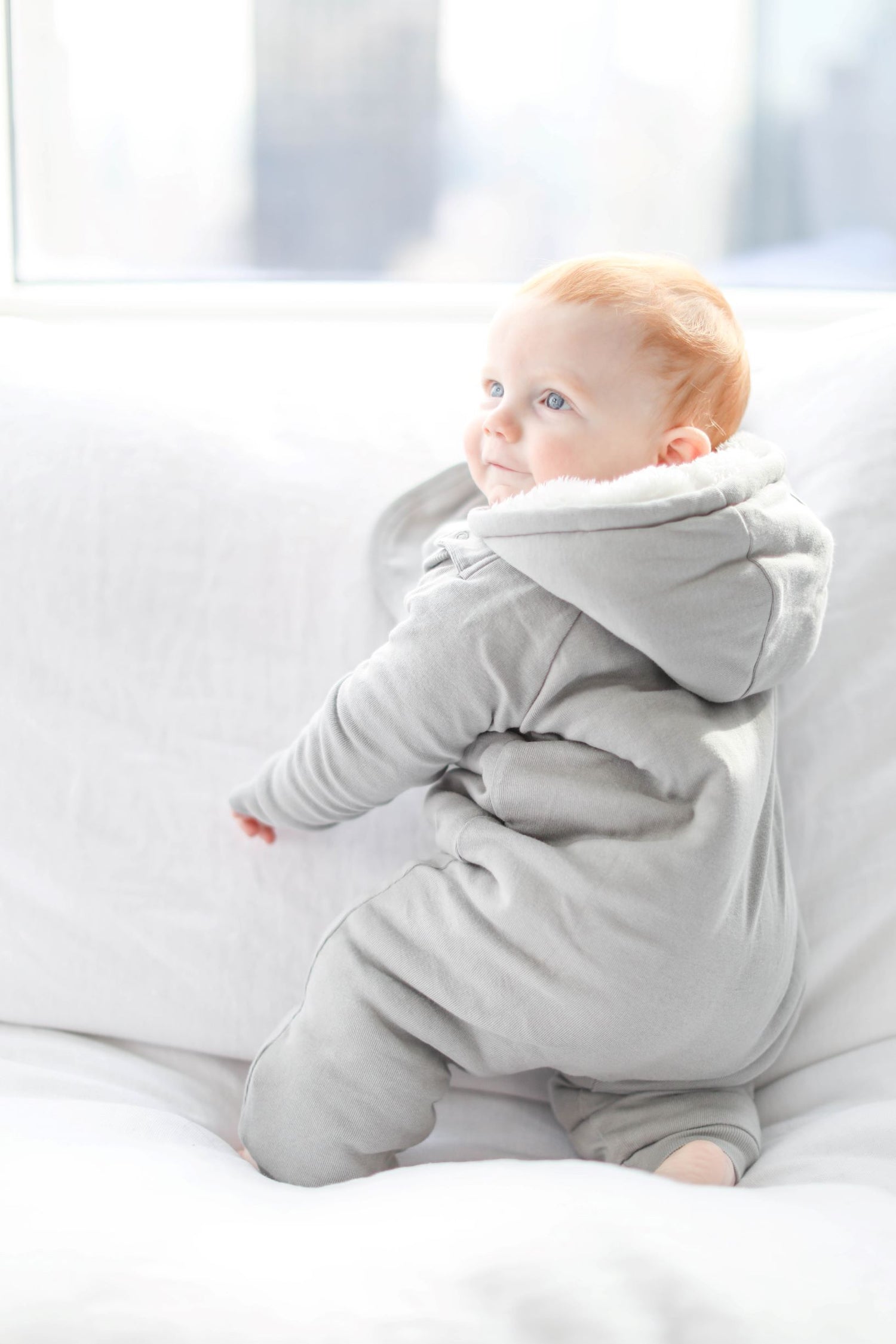 Gray baby jumpsuit and bib set by Fuchsia Milo, featuring a cozy, plush design for comfortable infant wear.