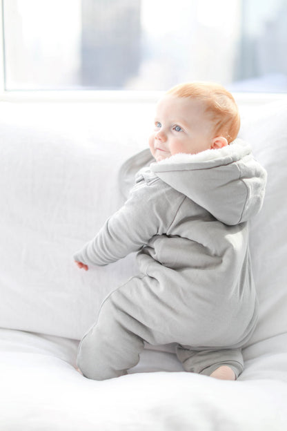 Gray baby jumpsuit and bib set by Fuchsia Milo, featuring a cozy, plush design for comfortable infant wear.