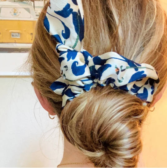 Green Athena chiffon hair scrunchie, soft and lightweight accessory with a delicate fabric design for stylish hair styling.