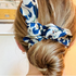 Green Athena chiffon hair scrunchie, soft and lightweight accessory with a delicate fabric design for stylish hair styling.