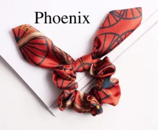 Green Athena chiffon hair scrunchie, soft and lightweight accessory with gathered fabric, ideal for stylish hair styling.