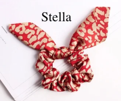 Green Athena chiffon hair scrunchie shown with soft, flowing fabric and elastic band, stylish hair accessory for various hairstyles.