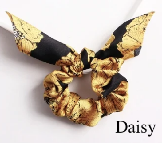 Green Athena chiffon hair scrunchie, soft and lightweight accessory for stylish hair styling, shown on a clean background.