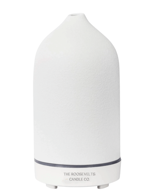 White Dione stone aromatic diffuser with sleek design, showcasing a diffuser with essential oils and a modern, minimalist appearance.