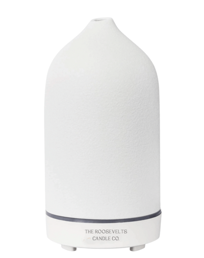 White Dione stone aromatic diffuser with sleek design, showcasing a diffuser with essential oils and a modern, minimalist appearance.