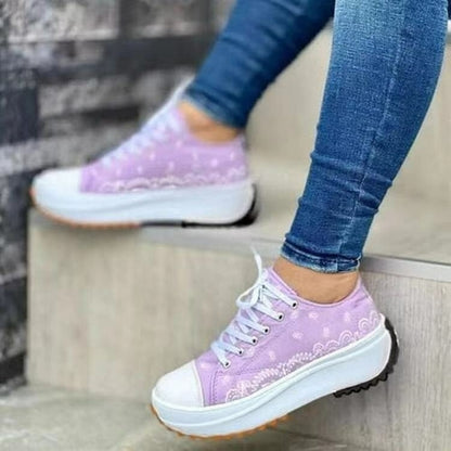 Red Iphigenia fashion pattern canvas women sneakers with casual sport style, featuring colorful activewear design and comfortable fit.