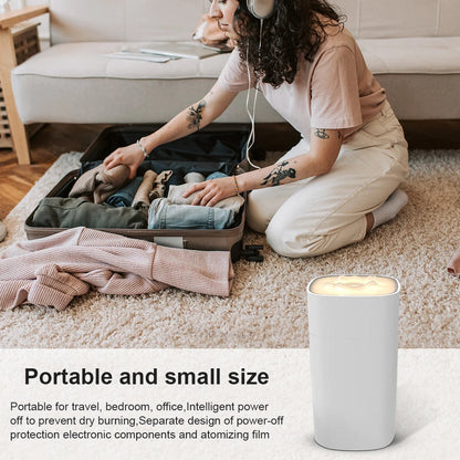 Maroon Asteria portable mini humidifier with mist spray, compact design, ideal for desktop use and aromatherapy.