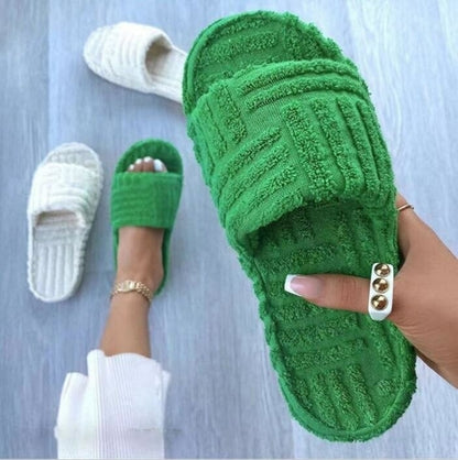 Red Iphigenia thick bottom embossed cotton fur women slippers with plush interior and textured sole for comfort.