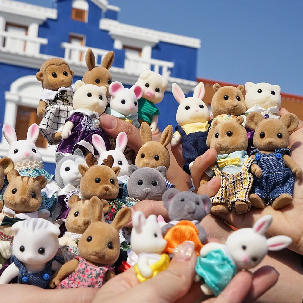 Small rabbit doll from AliExpress, part of 1/12 micro dollhouse set with reindeer, sheep, elephant, and squirrel figurines.