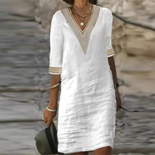 Yellow Eleusis elegant cotton linen dress with bag and wallet accessories, showcasing a stylish and comfortable fashion ensemble.