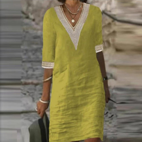 Yellow Eleusis elegant cotton linen dress, stylish and lightweight, shown in a natural fabric texture and flowing design.