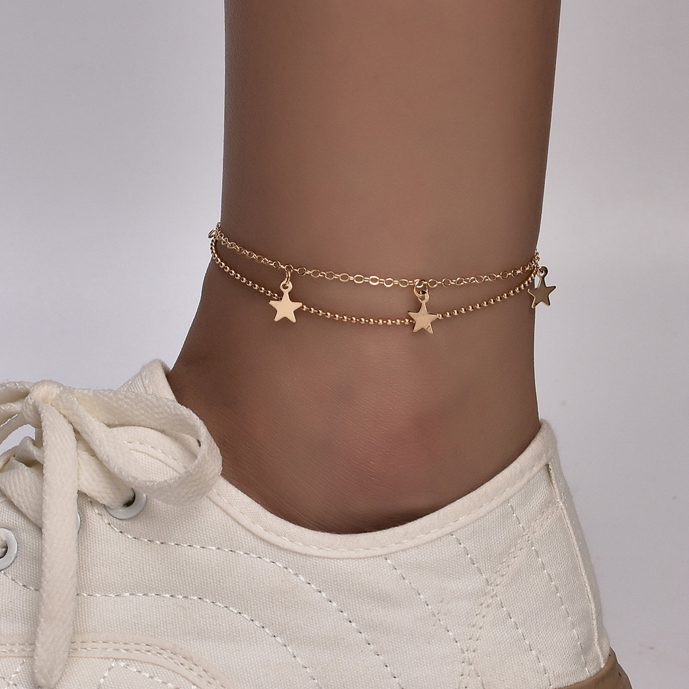 Silver plated Butterfly Bohemia ankle bracelet by Red Iphigenia with delicate chain and butterfly charm for boho-inspired style.