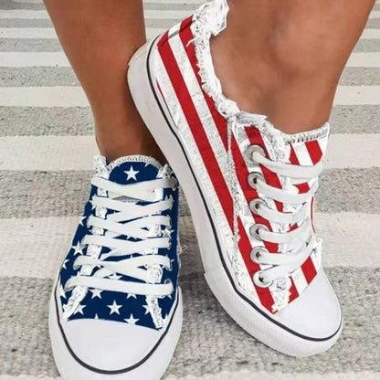 Silver Juneberry star striped lace-up flats with round toe, casual sneakers featuring a stylish star pattern and comfortable design.