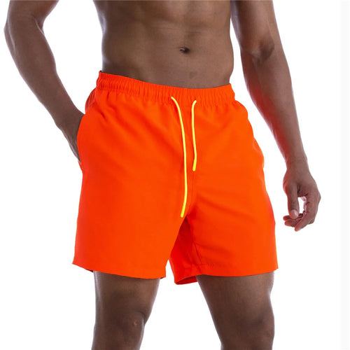 Raspberry Eurybia Sunga Beach Shorts swimwear with vibrant patterns, shown laid flat on a white background.