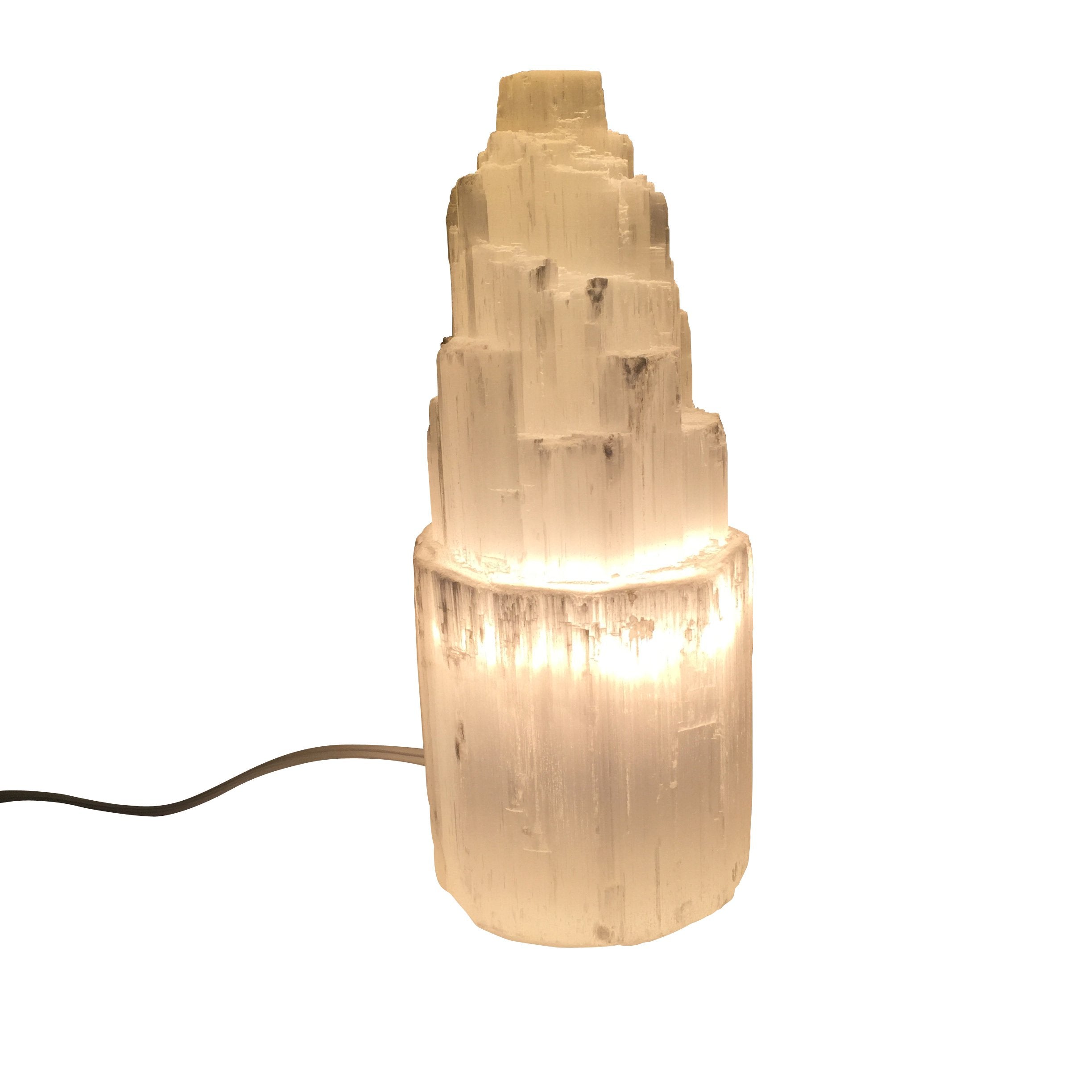 Small Teal Lily Selenite Skyscraper Lamp, a natural mineral home decor piece with a sleek, tower-like design.