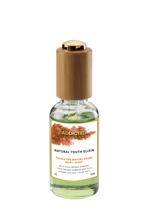 Yellow Bittercress Addicted Beauty Natural Youth Elixir Hair Oil bottle with herbal ingredients, for nourishing hair care.