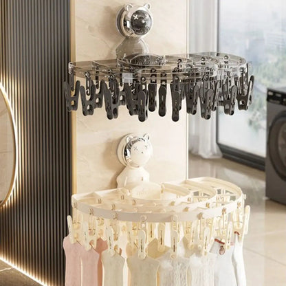 Maroon Asteria suction cup sock hanger with clips, foldable and retractable for drying and organizing socks on a smooth surface.