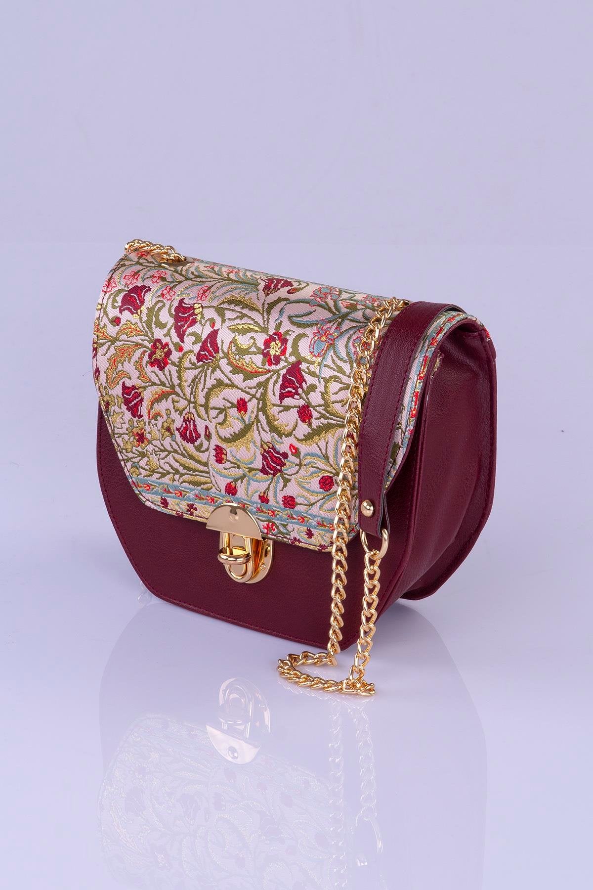 Elegant handmade Oriental crossbody handbag by Chocolate Eros featuring floral design and intricate craftsmanship.