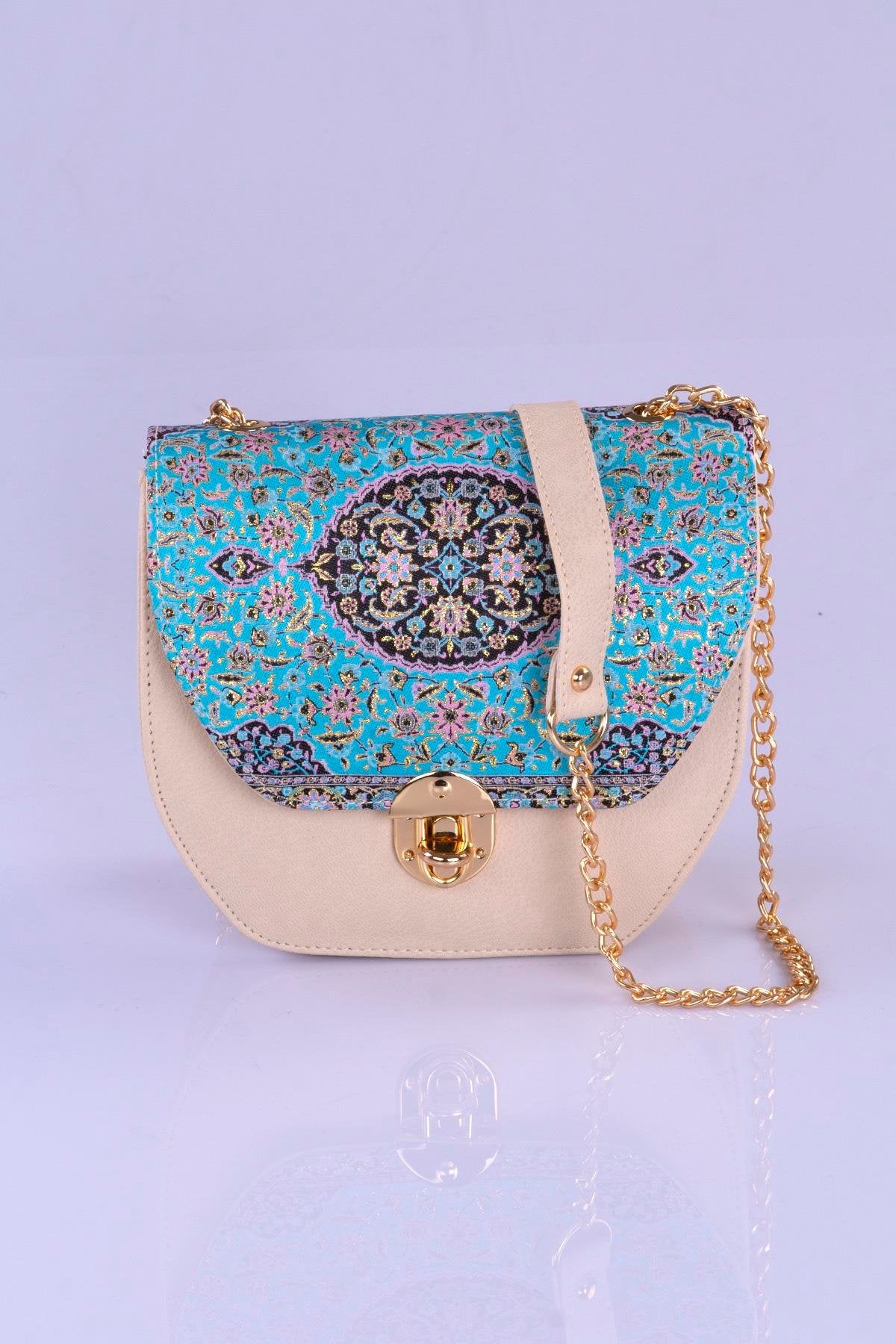 Beige handmade Oriental crossbody handbag with turquoise pattern by Chocolate Eros, featuring elegant design and intricate detailing.