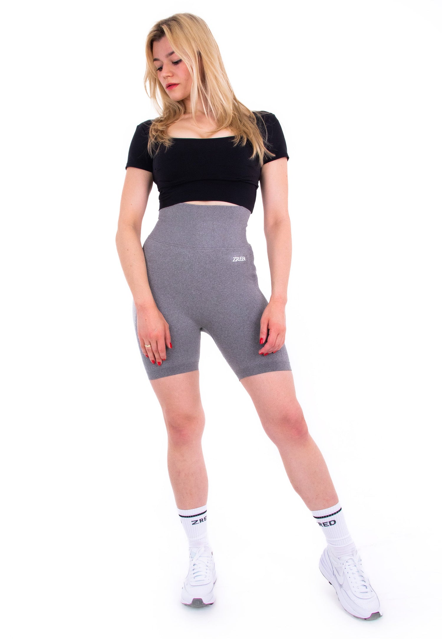 Coffee-colored high-waisted seamless shorts by Pear Juniper, shown from the front, highlighting their fitted, stretchy design.