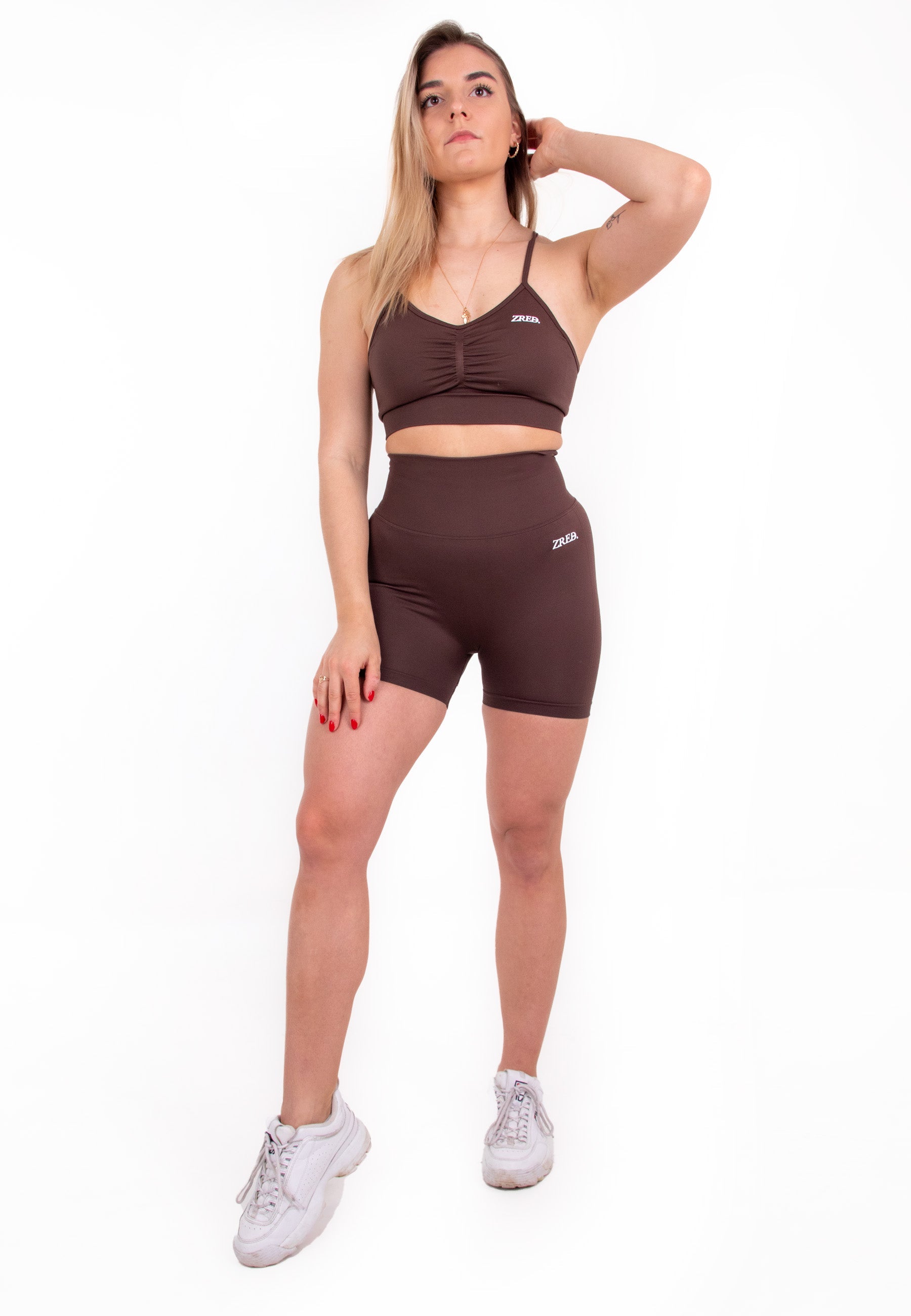 Coffee-colored Pear Juniper high-waisted seamless shorts shown from the front, highlighting the fitted design and smooth fabric.
