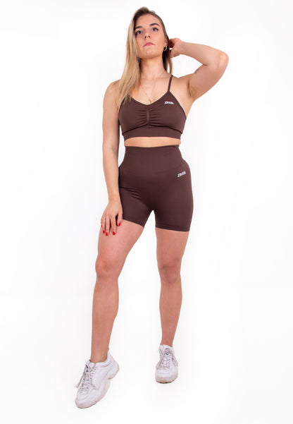 Coffee-colored Pear Juniper high-waisted seamless shorts shown from the front, highlighting the fitted design and smooth fabric.