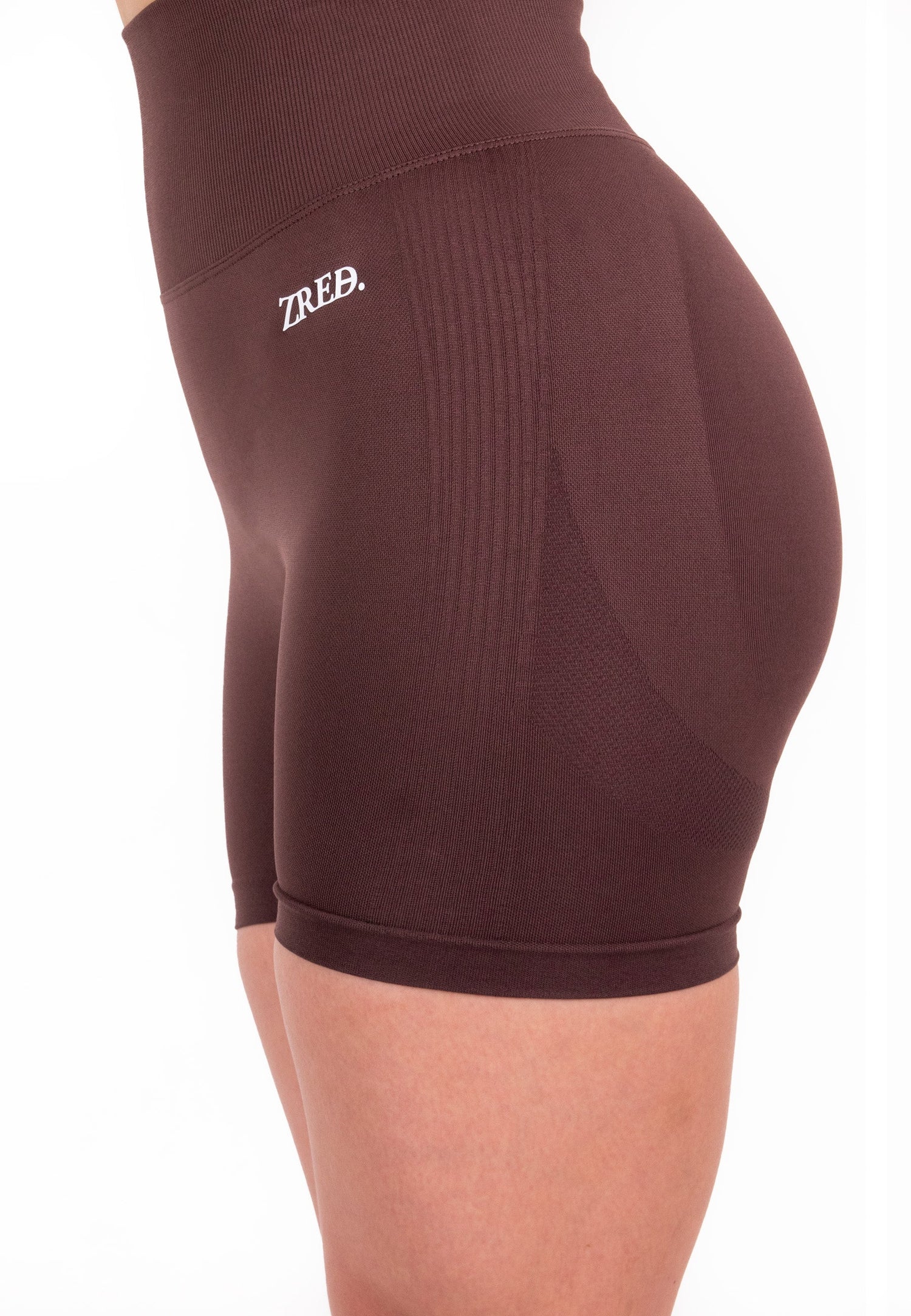 Coffee-colored Pear Juniper Shape high-waisted seamless shorts, close-up view highlighting smooth fabric and fit.