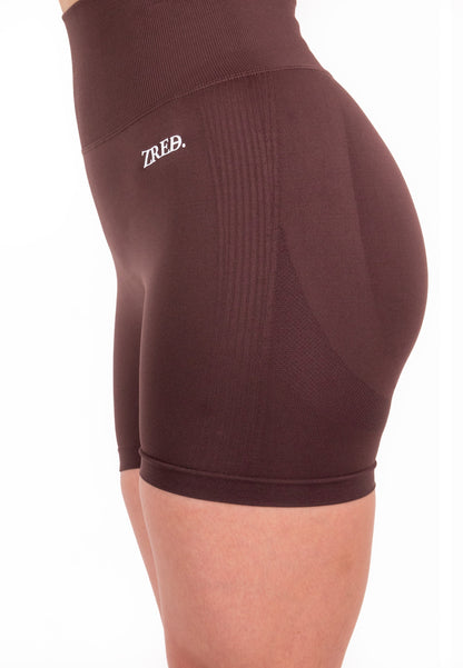 Coffee-colored Pear Juniper Shape high-waisted seamless shorts, close-up view highlighting smooth fabric and fit.