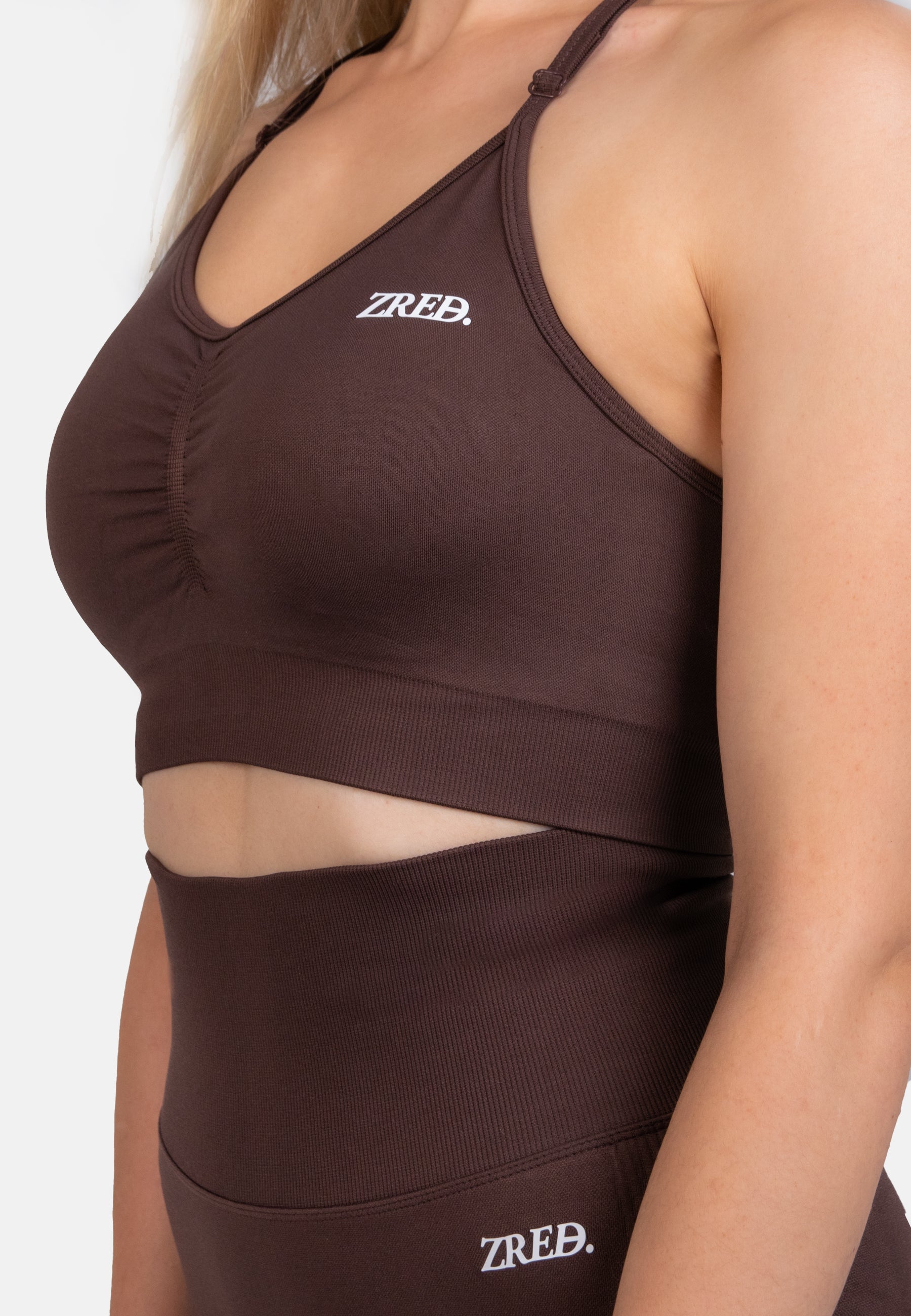 Coffee-colored Pear Juniper Shape Seamless Sports Bra with supportive design, front view showcasing its fitted, athletic style.