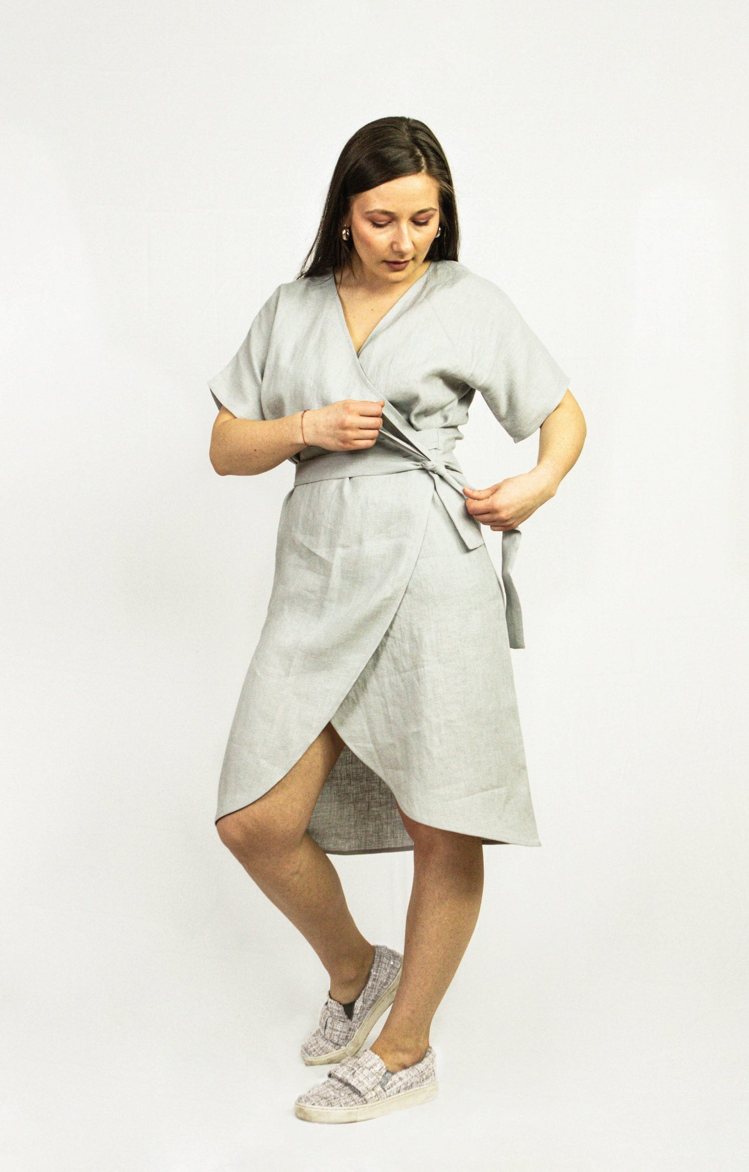Natural Light linen wrap dress by Magenta Sugarplum, shown on a model, featuring a flowing silhouette and soft fabric.