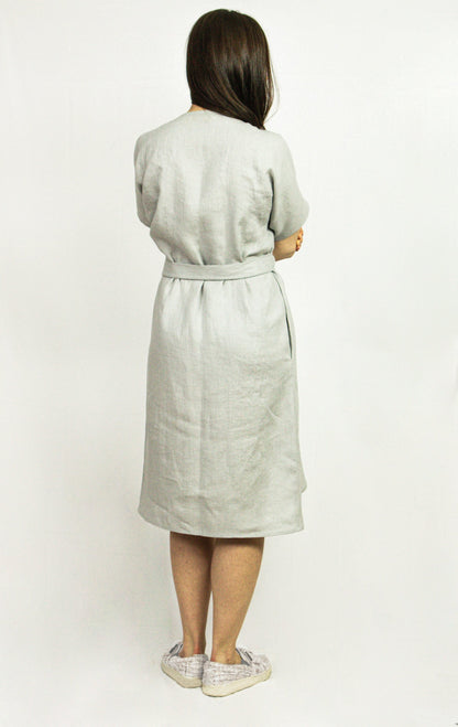 Natural Light linen wrap dress by Magenta Sugarplum, featuring a flowy design and soft fabric, shown on a model.