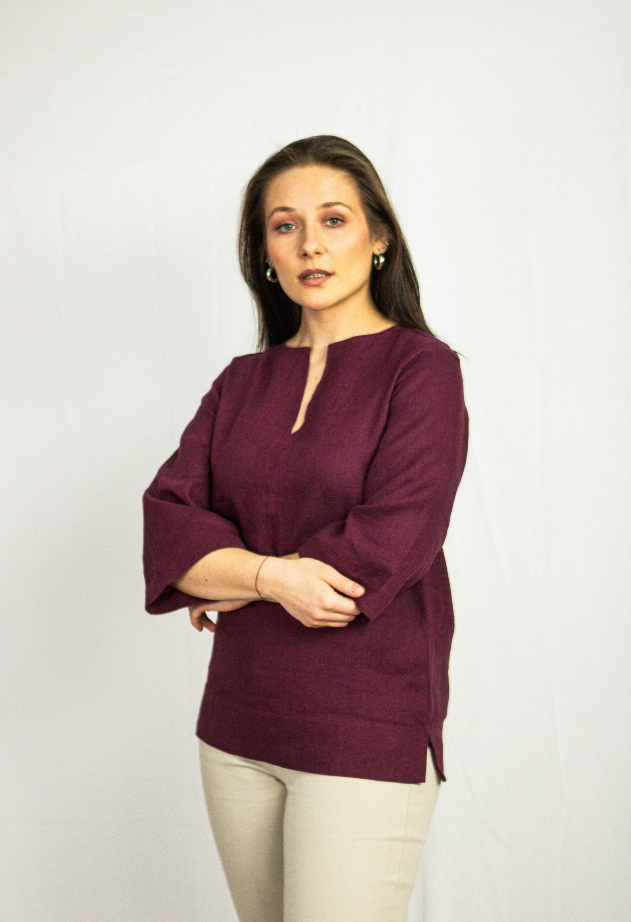 Dark plum linen oversize top from Magenta Sugarplum, featuring a relaxed fit and lightweight fabric, styled casually.