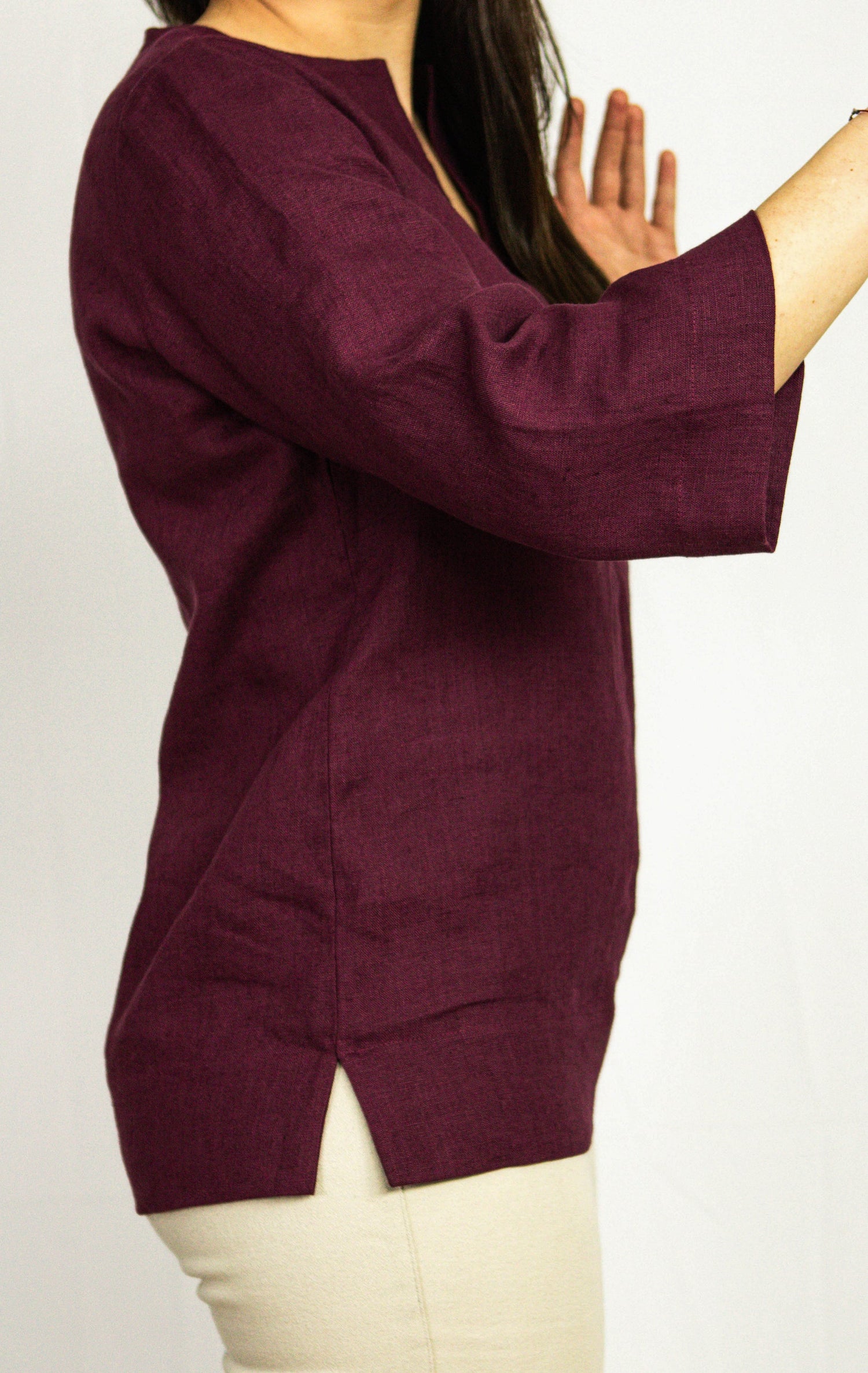 Dark plum linen oversize top from Magenta Sugarplum, featuring a relaxed fit and lightweight fabric, styled for casual wear.