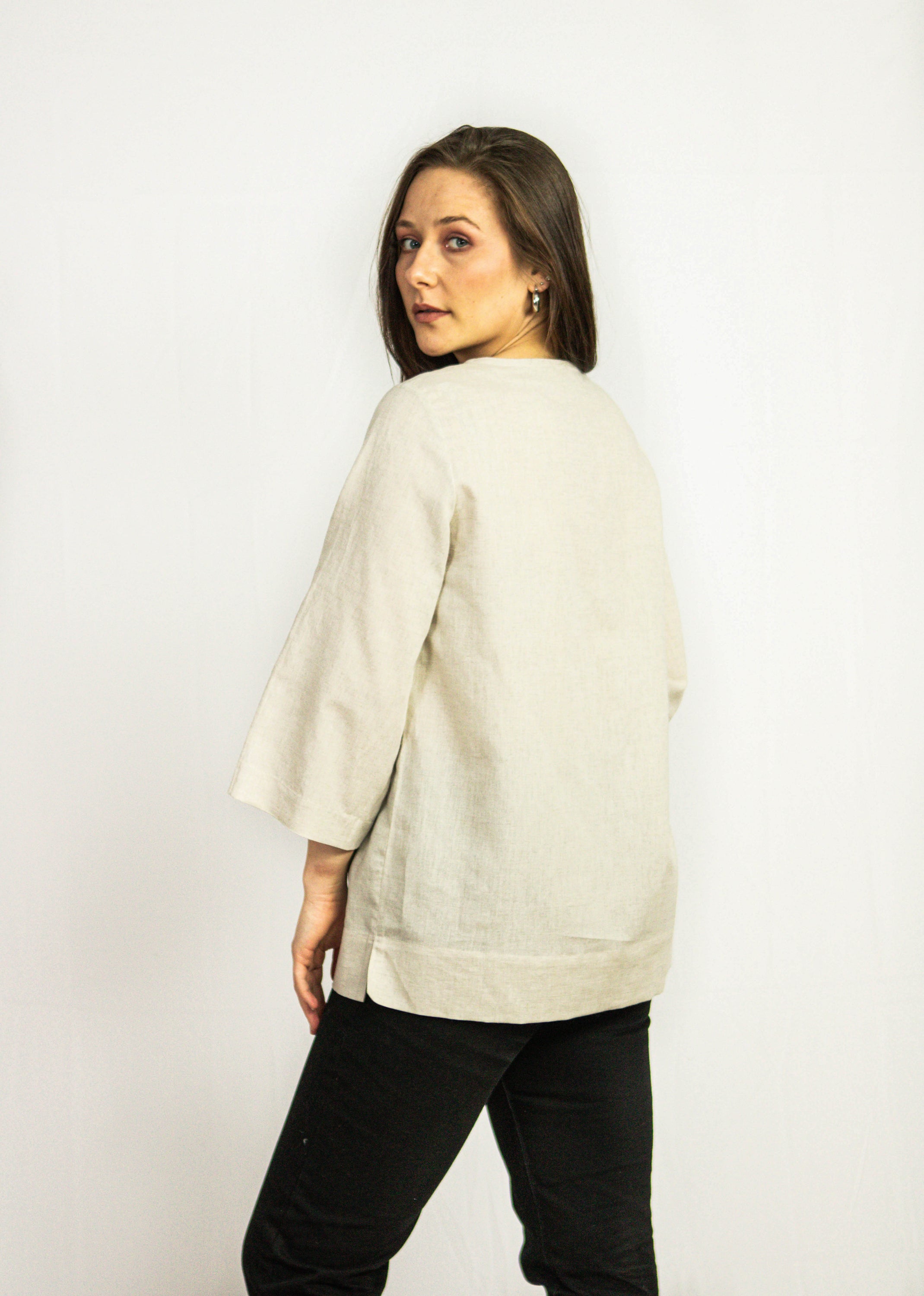 Dark plum linen oversize top from Magenta Sugarplum, featuring a relaxed fit and lightweight fabric, shown on a hanger.