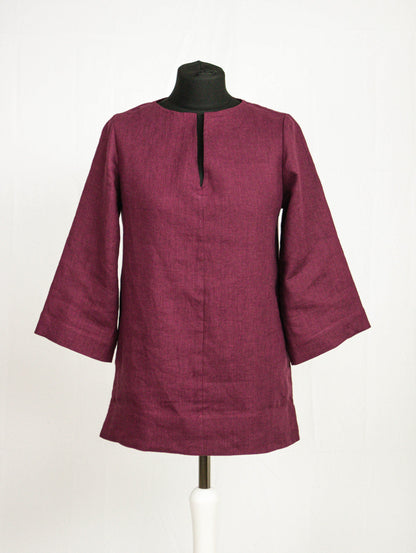 Dark plum linen oversize top by Magenta Sugarplum, featuring a relaxed fit and long sleeves, shown on a model.