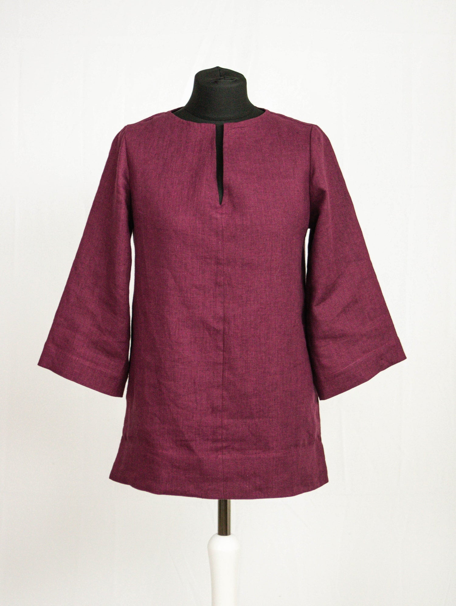 Asphalt grey linen oversize top by Magenta Sugarplum featuring relaxed fit and long sleeves, displayed on a hanger.