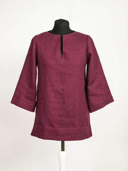 Asphalt grey linen oversize top by Magenta Sugarplum featuring relaxed fit and long sleeves, displayed on a hanger.