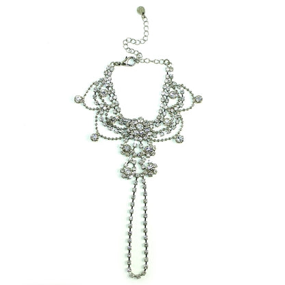 Silver draping crystal handpiece bracelet by Cyan Ismene featuring intricate crystal arrangements and elegant silver detailing.