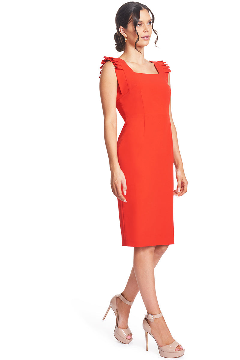 Peach Dionysus Monarch red midi sheath dress with pleated shoulder detail, worn by a woman walking in a stylish outfit.